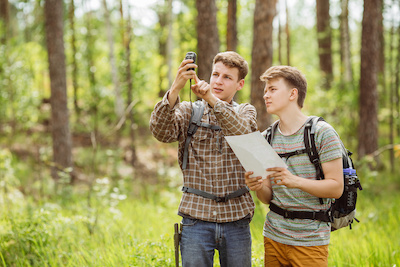 two young tourist determine the route map and navigator